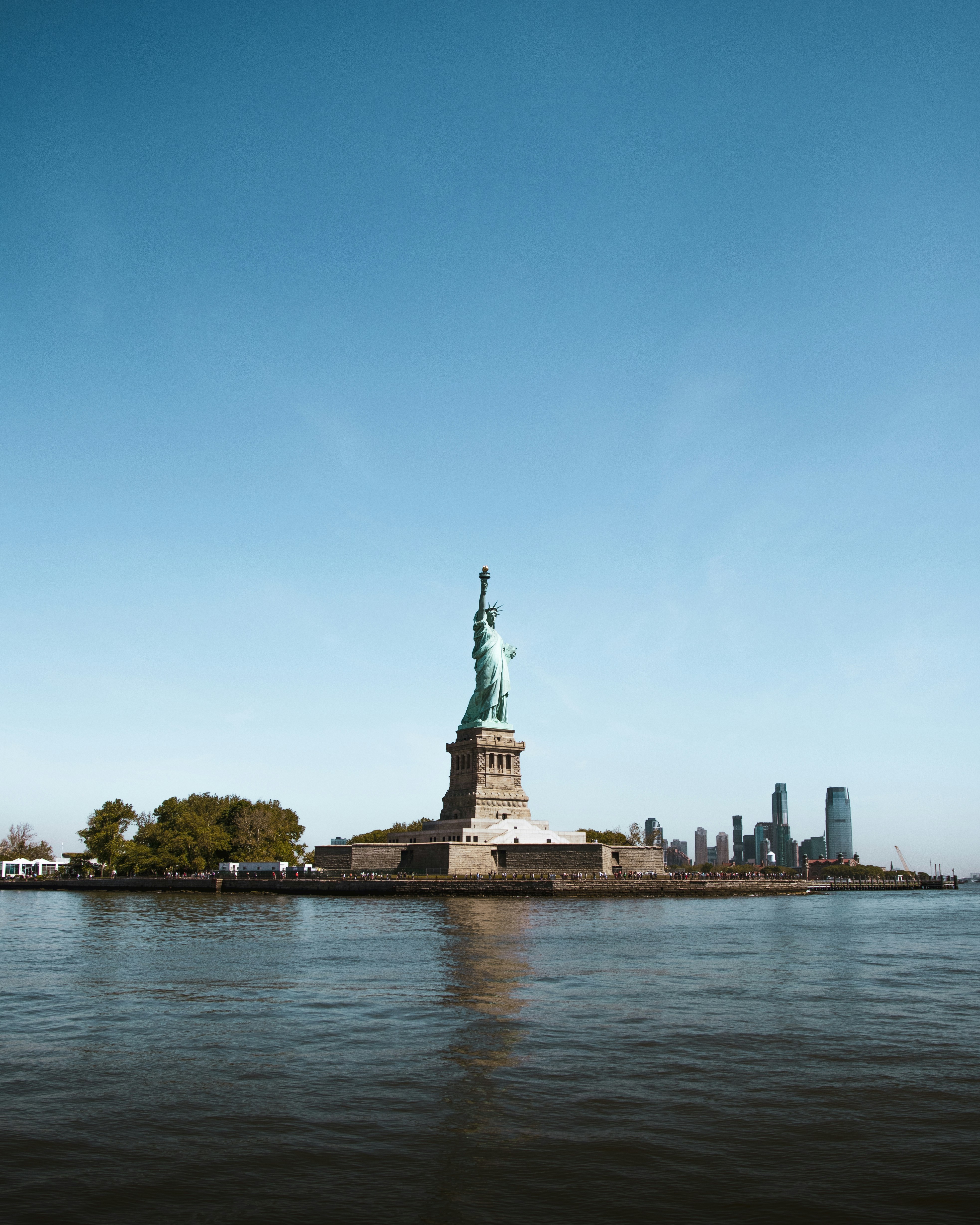 The Statue of Liberty and New York harbor, symbols of the nation's largest city and a major procurement market